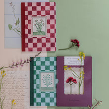 Load image into Gallery viewer, Two notebooks with floral designs on a green background