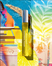 Load image into Gallery viewer, antica farmacista happy hour fragrance in a yellow glass vial with silver top, set on a colorful collage background
