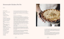 Load image into Gallery viewer, A printed recipe spread page for Homemade Chicken Pot Pie, with the left side containing ingredient text and the right side showing a close-up photo of a hand holding a baked pie.