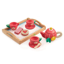 Load image into Gallery viewer, tender leaf toys wood tea play set including a tray, creamer cup, two teacups, two cookies, spoon, teapot and two teabags. teapot is painted to look like a strawberry, and the cups are painted red with a white daisy and yellow center. tray is wood base with a white painted 'doily' on it.