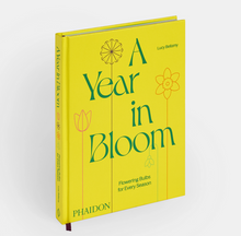 Load image into Gallery viewer, cover image of Phaidon's A Year in Bloom: Flowering Bulbs for Every Season featuring a bright yellow background with graphic colored line illustration of a tulip, allium and daffodil