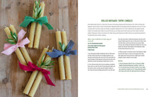 Load image into Gallery viewer, Rolled beeswax taper candles with colorful ribbons on a wooden surface, accompanied by text on the right.