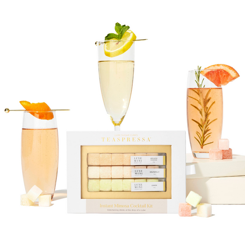 Teaspressa's Luxe Mimosa Cubes mixer kit featuring Arcadia Orange, Lemon, and Grapefruit flavored cocktail cubes to drop directly into your champagne or sparkling water or an instant bubbly experience at home or on the go.