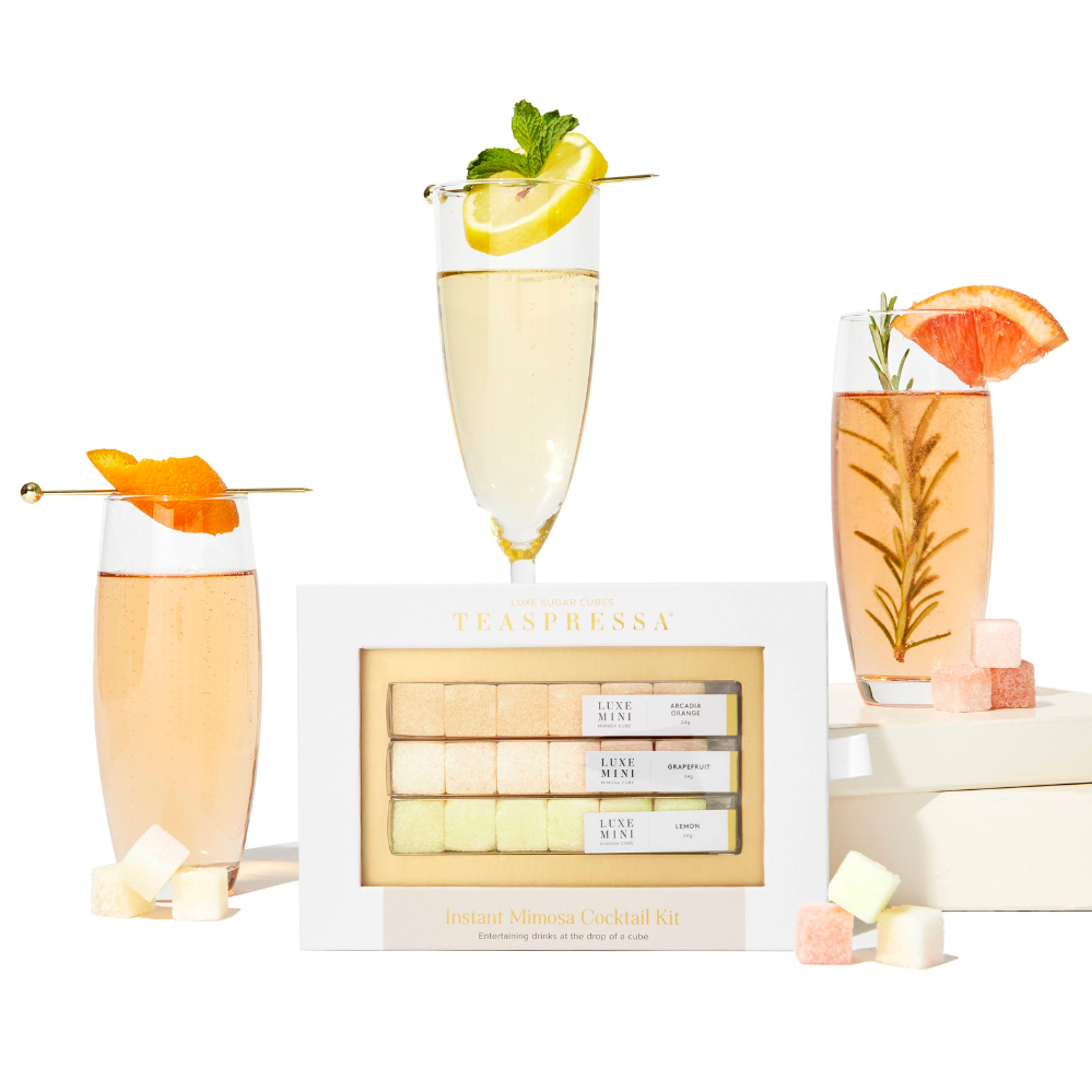 Teaspressa's Luxe Mimosa Cubes mixer kit featuring Arcadia Orange, Lemon, and Grapefruit flavored cocktail cubes to drop directly into your champagne or sparkling water or an instant bubbly experience at home or on the go.