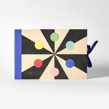 Load image into Gallery viewer, Artist's sketchbook with a geometric design featuring colorful circles on a black background
