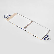 Load image into Gallery viewer, Open notebook with spiral binding on a white background
