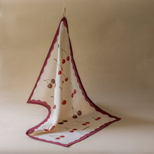 Load image into Gallery viewer, Kitchen tea towel with cherry pattern draped over a hook against a beige background
