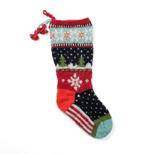 Multi-colored 100% wool knit stocking with snowflakes, trees, stripes and dots. Made in Nepal by Lost Horizons.