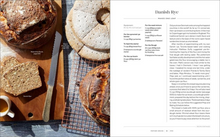 Load image into Gallery viewer, A two-page spread from a cookbook showing a large photo of rustic Danish rye bread on a cooling rack and a text panel titled 'Danish Rye: Make One Loaf' with recipe details and ingredients.
