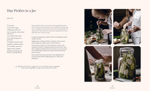 Load image into Gallery viewer, A printed recipe book or magazine spread titled "Day Pickles in a Jar," with a left column of recipe text and a four-panel photo collage on the right showing hands preparing pickled vegetables and glass jars.
