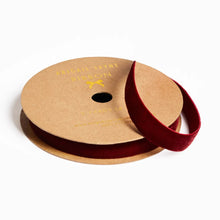 Load image into Gallery viewer, Spool of red velvet ribbon on a cardboard reel with 'Abigail Jayne Ribbon' branding.
