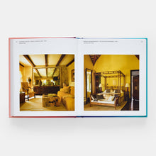 Load image into Gallery viewer, Open book showing interior design images of a living room and bedroom.
