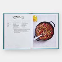 Load image into Gallery viewer, Open cookbook showing a recipe for chili con carne with a photo of the dish on a white background.
