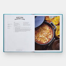 Load image into Gallery viewer, Open cookbook showing a recipe for pear and almond cake with an image of the dessert.
