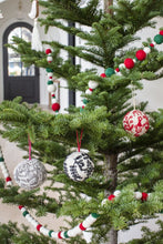Load image into Gallery viewer, felted ball ornament with red base and white felted embroidery design
