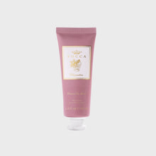 Load image into Gallery viewer, A tube of Tocca Cleopatra hand cream, in a dusty rose pink color with a white and gold label, set against a light gray background.
